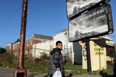 A child walks down a street on Oct. 11, 2012, in Camden, N.J., the most impoverished city in the United States, with nearly 32,000 of Camden's residents living below the poverty line.