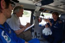 Eduardo Salas, an industrial organization psychologist, works with EMTs on a helicopter landing pad at Florida Hospital in Orlando last April. (American Psychological Association)